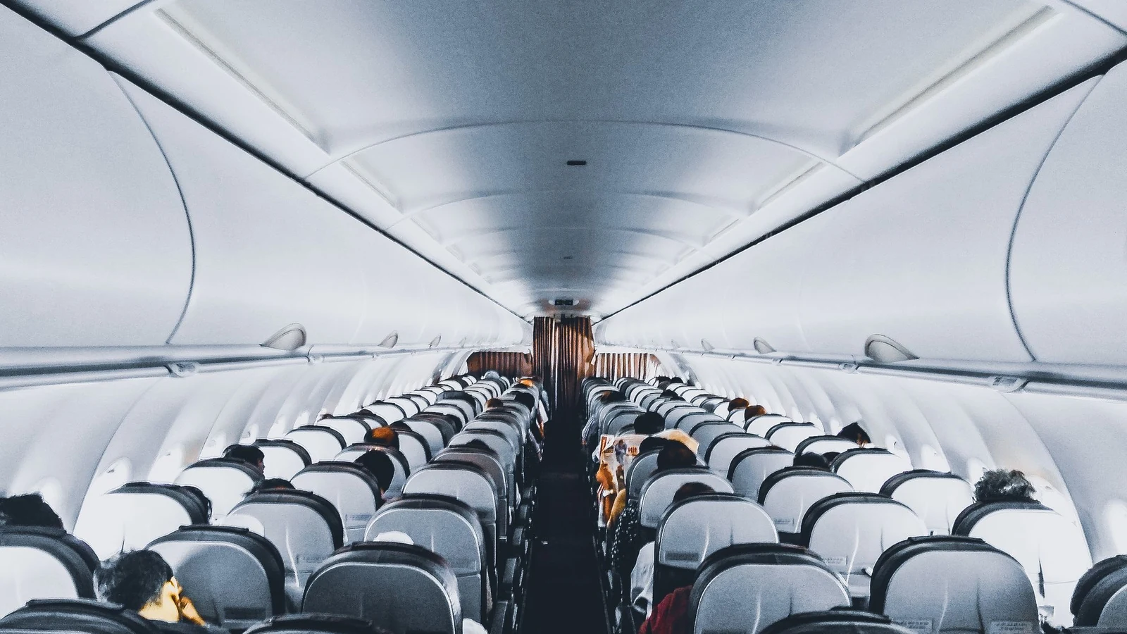 Aircraft cabin aisle — filing a flight delay compensation claim