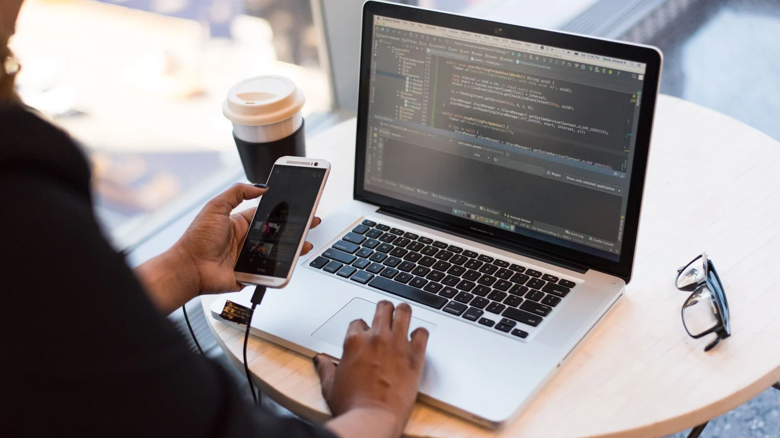 Comparing flight prices on a laptop — total trip cost