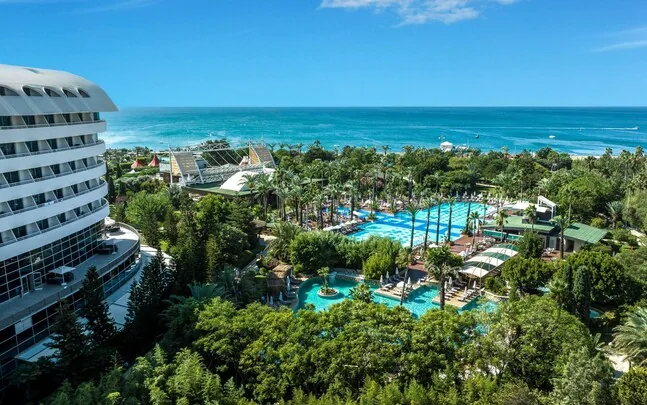 Concorde De Luxe Resort — distinctive jet-shaped hotel and lagoon pools in Lara
