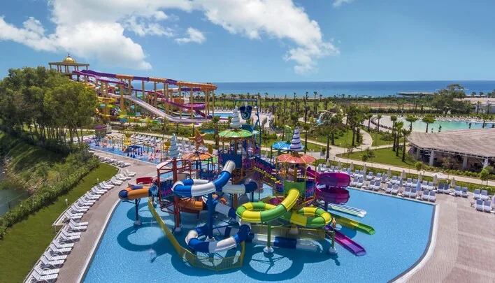 Delphin Be Grand Resort — colourful water park slides and splash pools by the beach