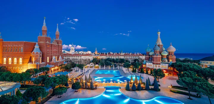 Kremlin Palace Lara — Russian-palace architecture lit around the central pool at dusk