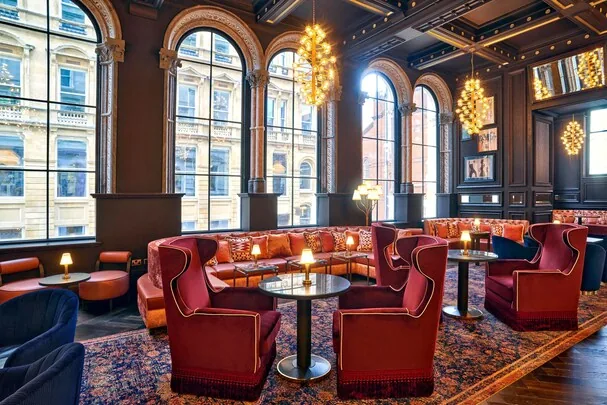 The Grand Hotel Birmingham — velvet lounge with arched windows and city views