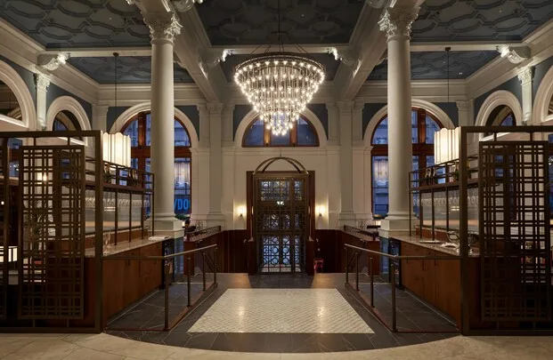 The Parkgate Hotel — grand lobby with crystal chandelier and arched windows