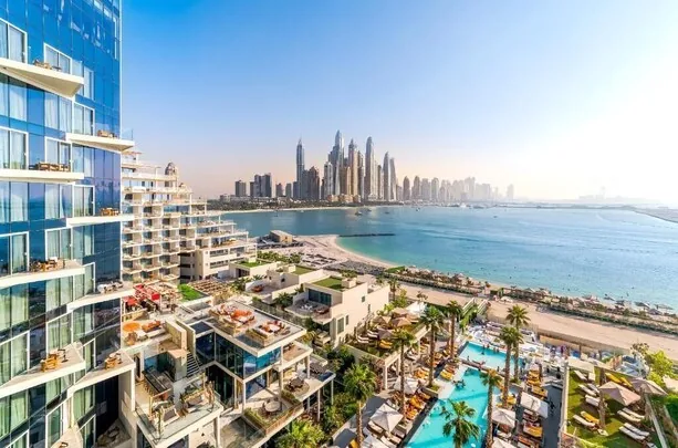 FIVE Palm Jumeirah Dubai — beachfront pool with Marina skyline