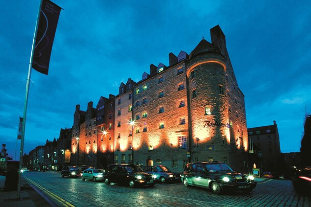 Radisson Blu Edinburgh — historic stone facade on the Royal Mile at dusk