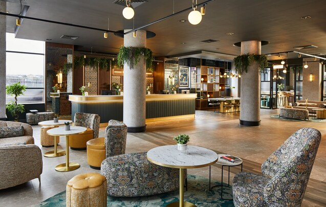 Leonardo Royal Hotel Glasgow — lobby lounge with marble tables and seating