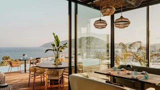 Aguas de Ibiza Grand Luxe — rooftop pool and spa beside the marina at Santa Eulària