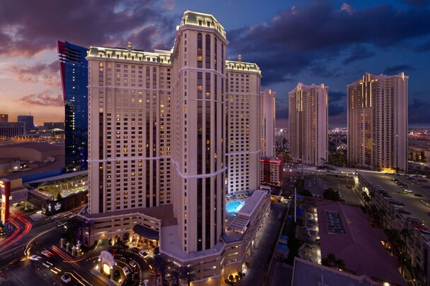 Marriott's Grand Chateau — tower exterior at dusk with rooftop pool