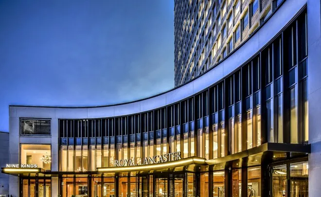 Royal Lancaster London — illuminated entrance on Lancaster Terrace at dusk