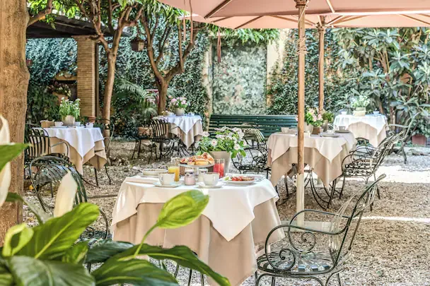 Hotel Santa Maria — courtyard breakfast garden in Trastevere, Rome