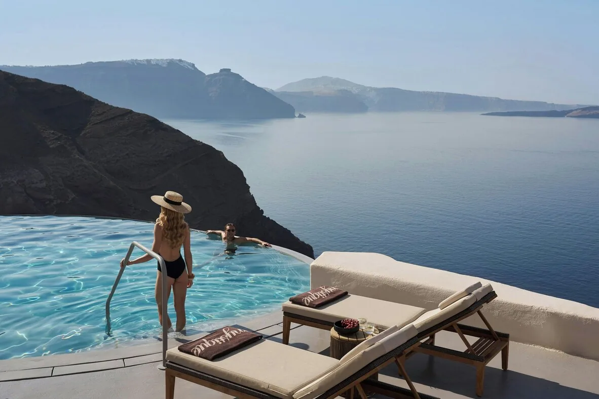 Mystique — caldera terrace and cave pool, Imerovigli, Santorini