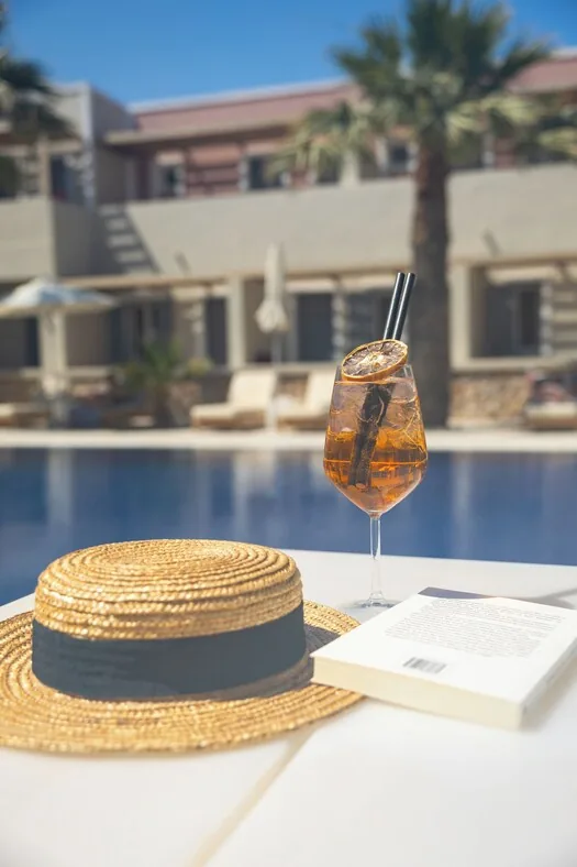 Rosebay Hotel — pool and black-sand beach, Perissa, Santorini