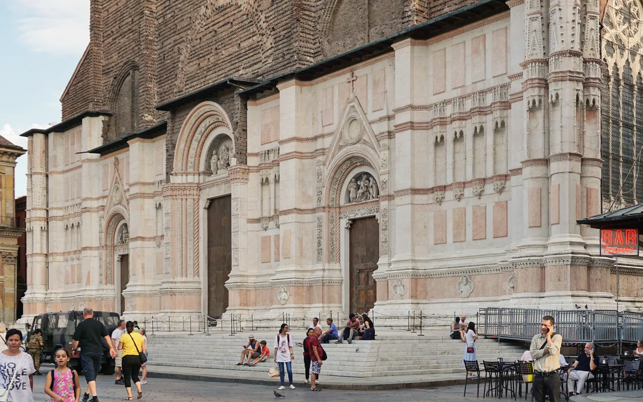 Unfinished brick and marble facade of San Petronio on Piazza Maggiore, Bologna