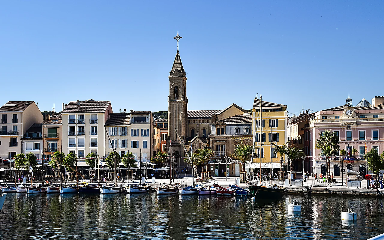 Fishing boats and the church above the harbour in Cassis, France