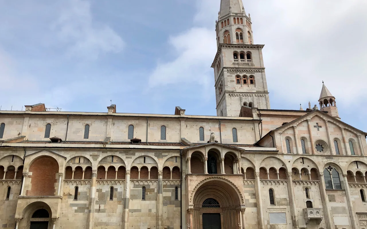 West facade of Modena Cathedral on Piazza Grande, Italy