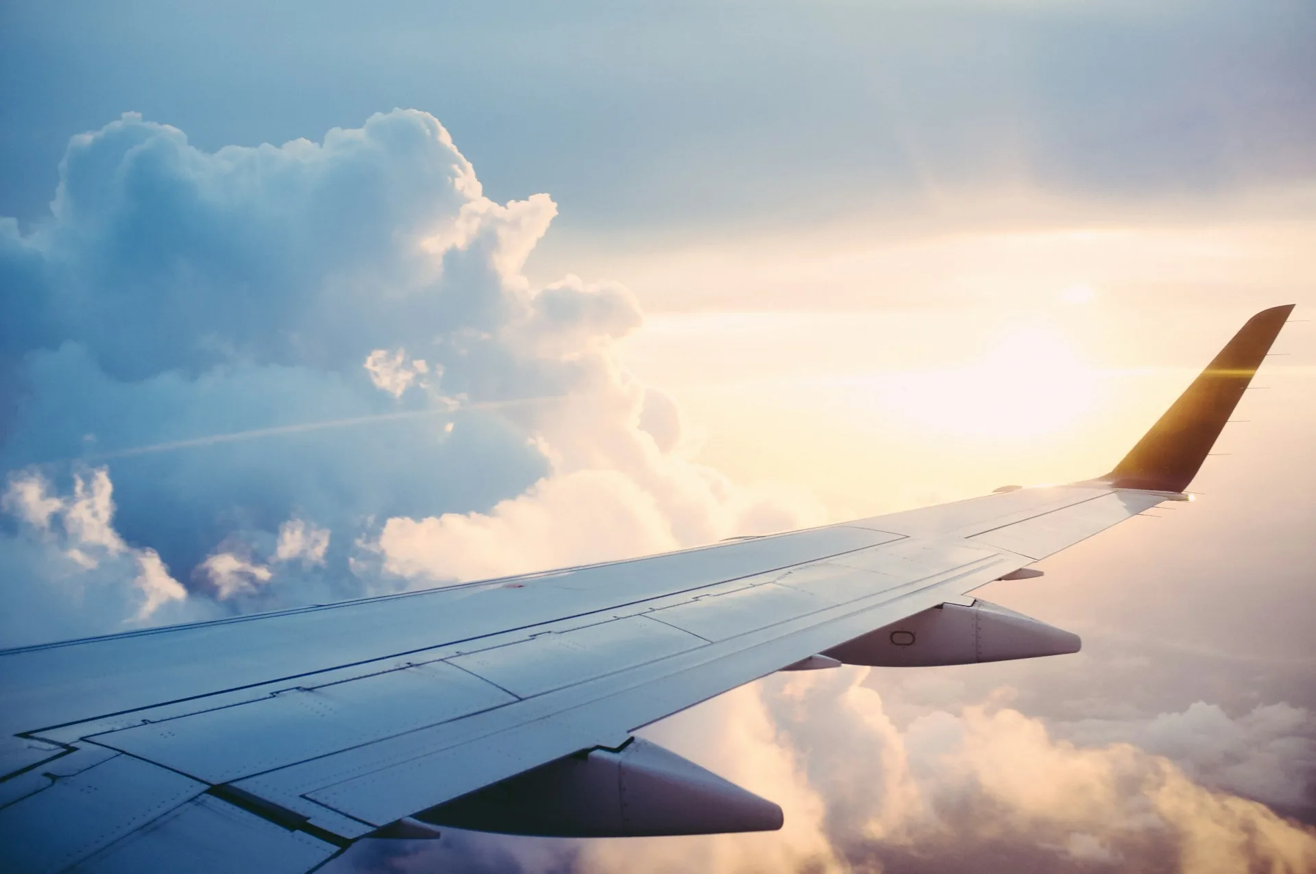 Airplane wing above the clouds — when to book flights